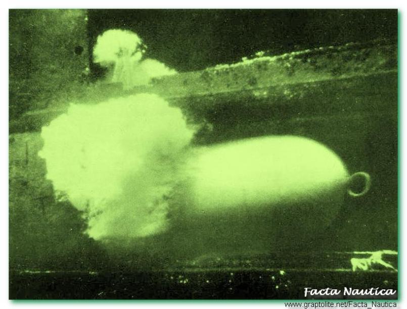 Presumably, the first underwater photo ever taken of a torpedo leaving the the tube!